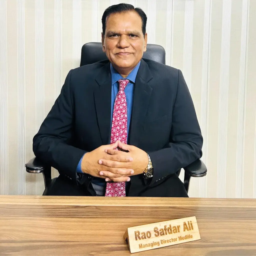 "Rao Safdar Ali, Managing Director of Medlife, seated at his office desk in formal attire"