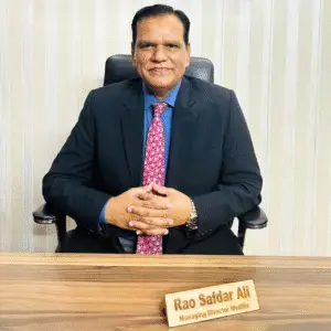 "Rao Safdar Ali, Managing Director of Medlife, seated at his office desk in formal attire"